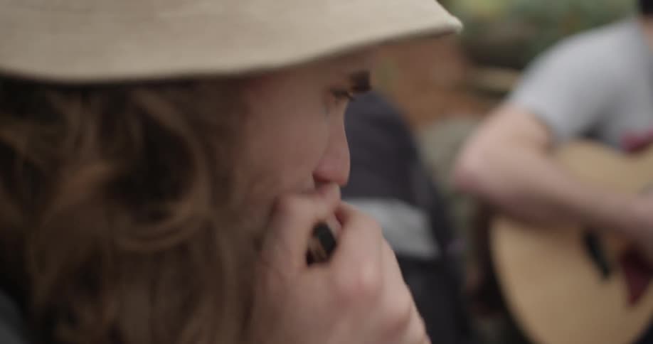 Closeup of man playing harmonica