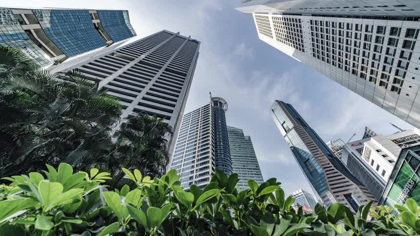 City skyscrapers under blue sky and clouds