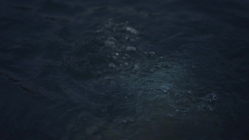 Water splashes as a person struggles to surface