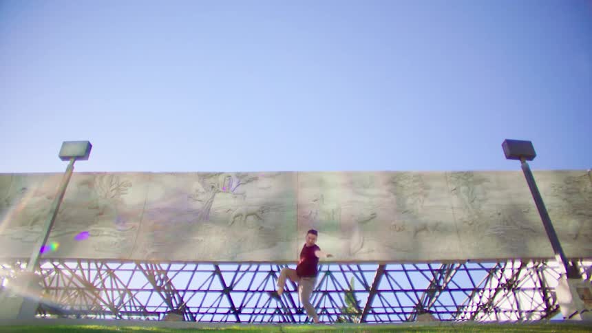 A man is dancing up on the platform