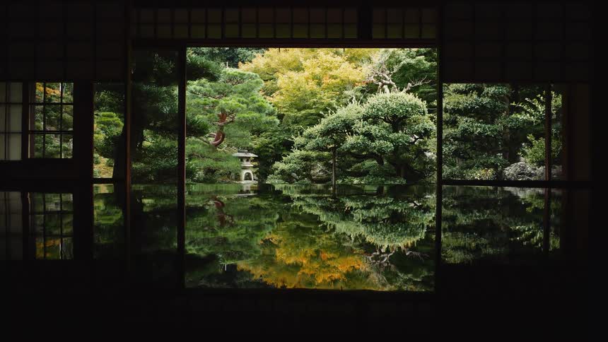 Beautiful calm japanese garden reflecting on the polished floor of a house