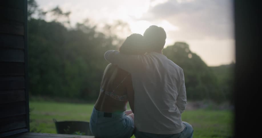 A couple hug outside