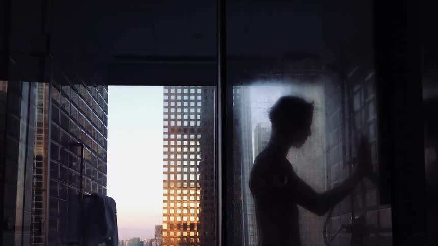 A man is taking a shower at home