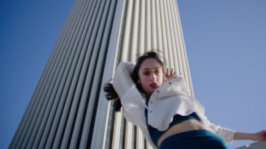 A woman is dancing outside