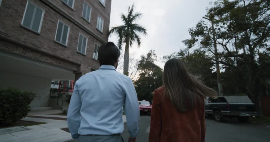 A man and woman walking outside together