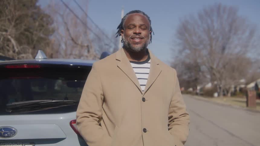 A portrait of a man standing outdoors