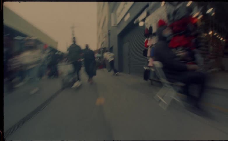 Crowds walk down the alley
