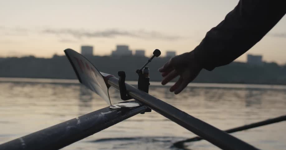 Oar with a blade on the end is secured into a fulcrum near the river