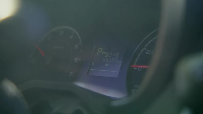 Car dashboard with controls and devices for measuring speed and distance