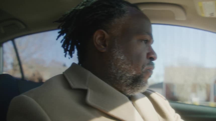 A man is driving in town