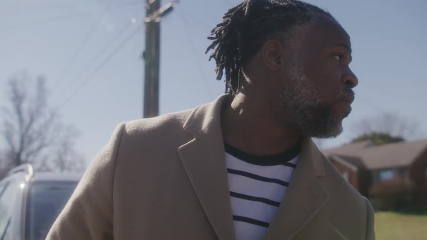 A man looks around outside