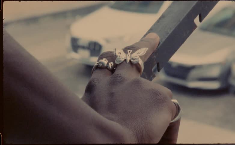 A person is wearing silver rings