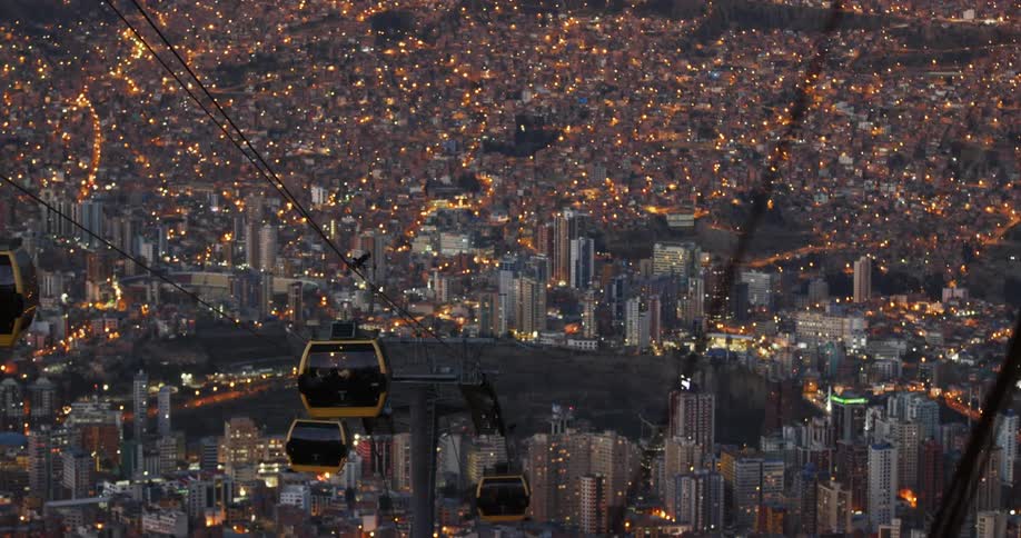 Aerial tram cars move on cable lines headed to downtown