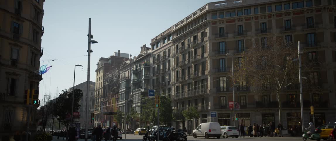 A view of cars driving down Passeig de Gracia in Barcelona, Spain