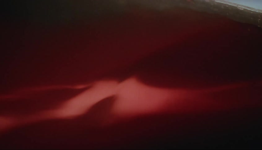 Abstract red liquid swirling