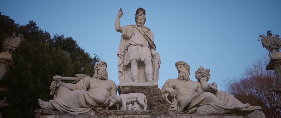 Classical marble sculpture in front of a blue sky