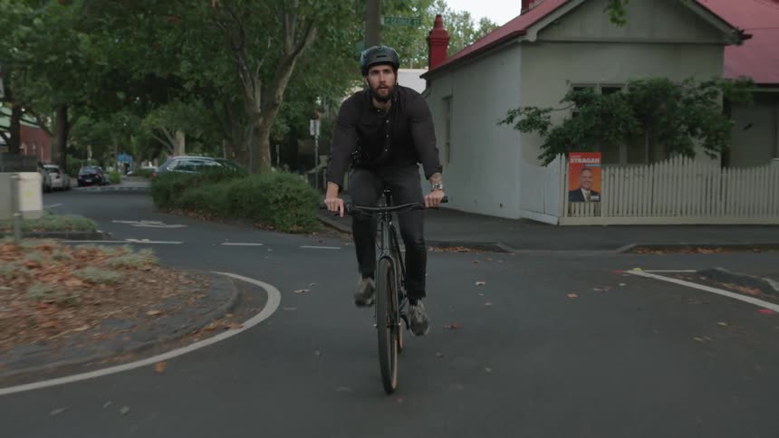 A man riding a bicycle outdoors