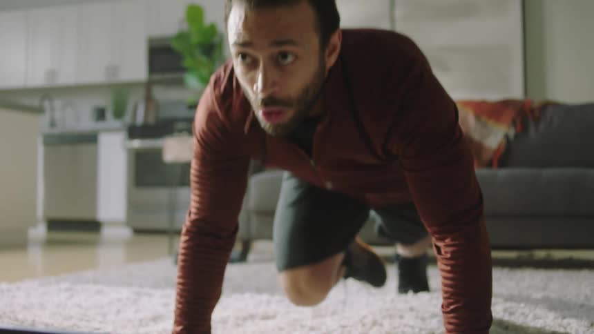 A man is working out at home