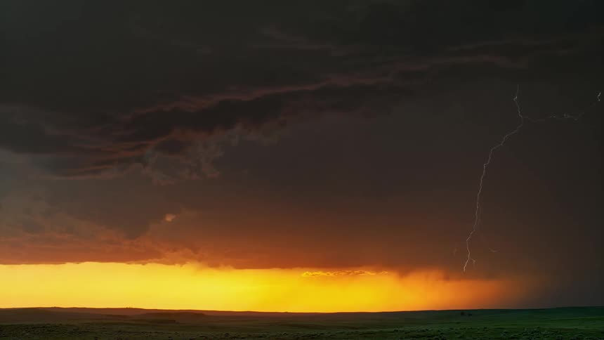 Lightning strikes through dark dense clouds during a storm