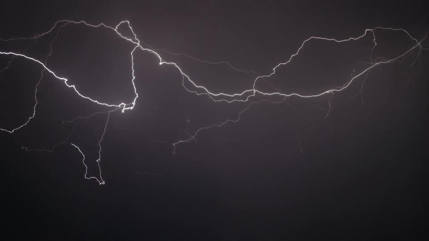 Lightning is flashing in the sky during a storm