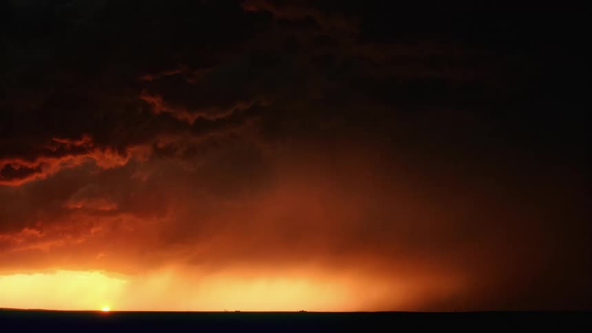 Dark clouds fill the sky as lightning flashes across it