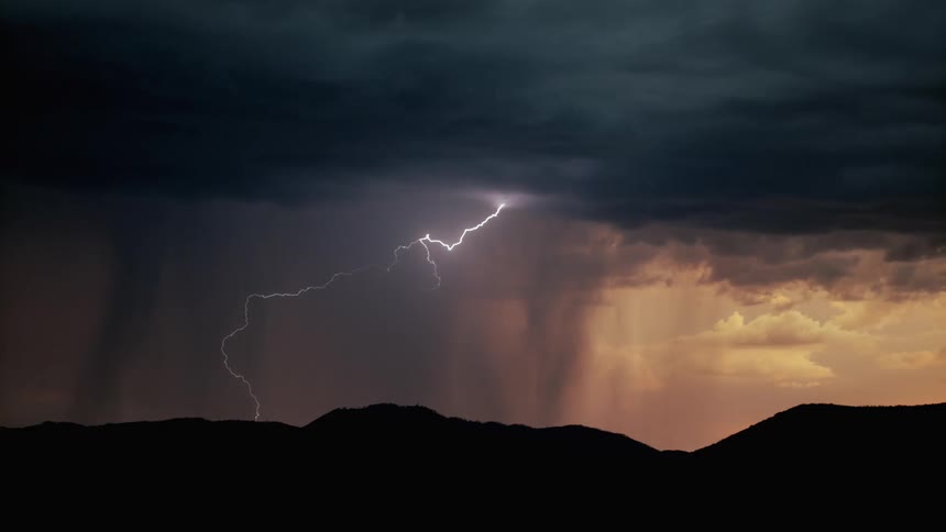 Lightning flashes from the large clouds