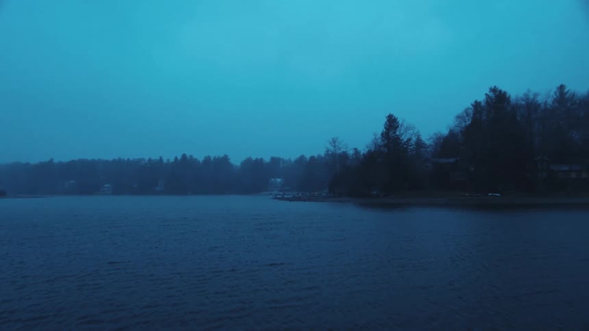 A view of the lake is displayed at night