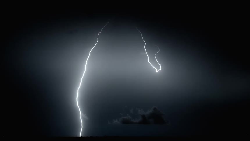 Lightning is flashing outdoors at night