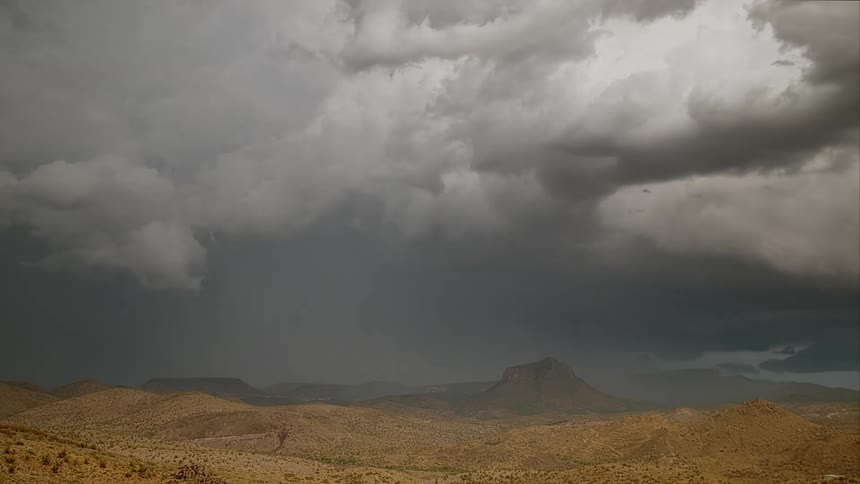 Its storming in a desert area with lightning