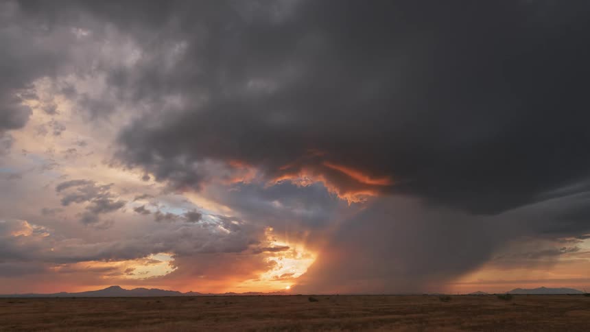 Clouds are forming into a storm at sunset
