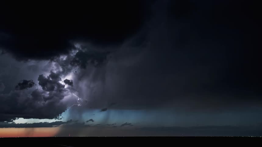 Lightning flashing in a cloudy sky during a thunderstorm