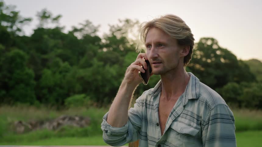 A man is talking on his cell phone