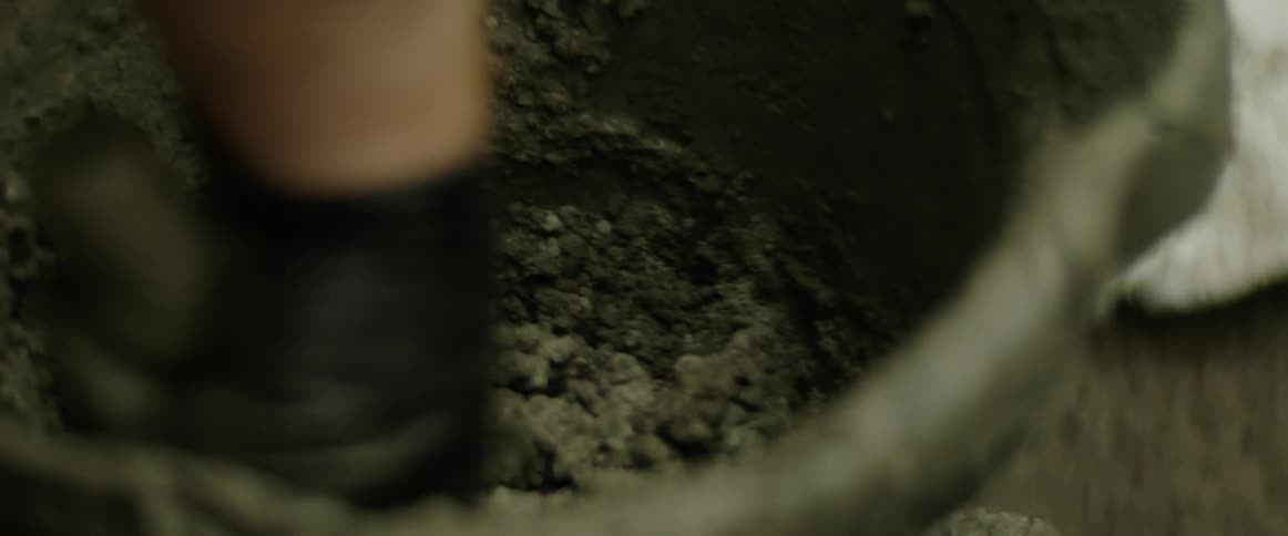 A person is mixing pottery clay together