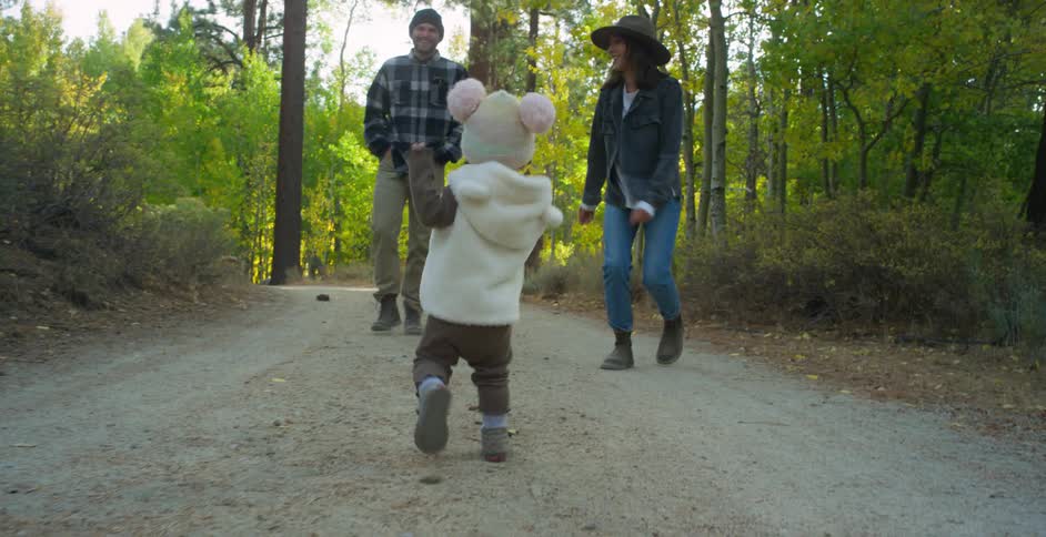 A family is hiking on a trail together in spring
