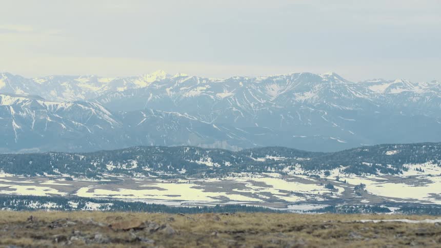 Aerial view of mountains in winter are displayed at dusk