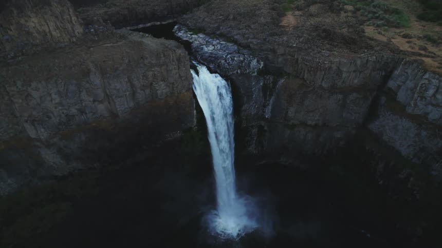 Aerial view of a waterfall is displayed in spring