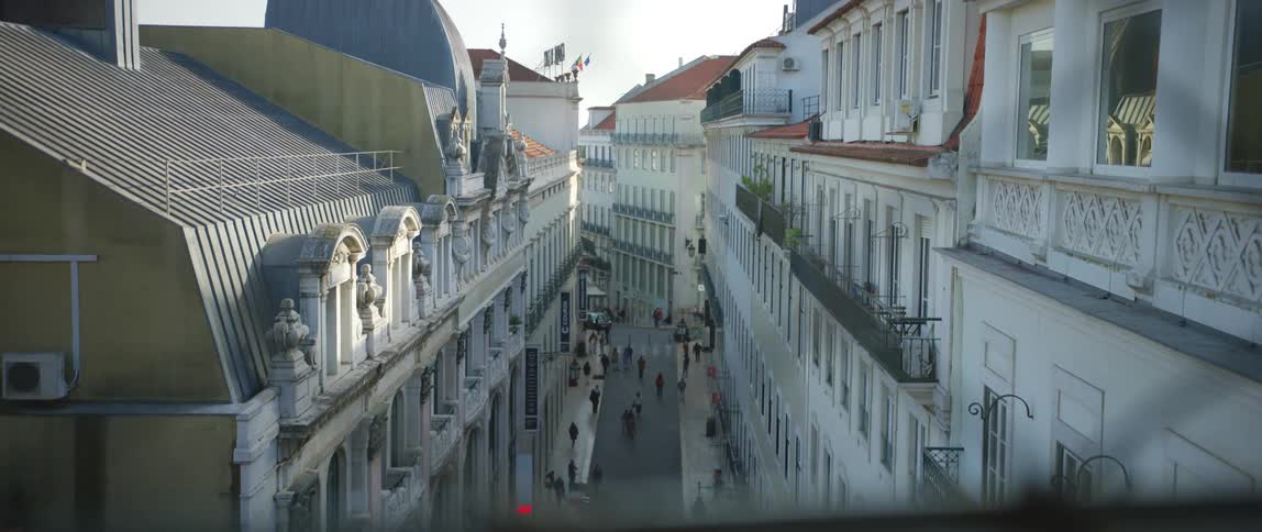 Pedestrians are walking through a downtown city