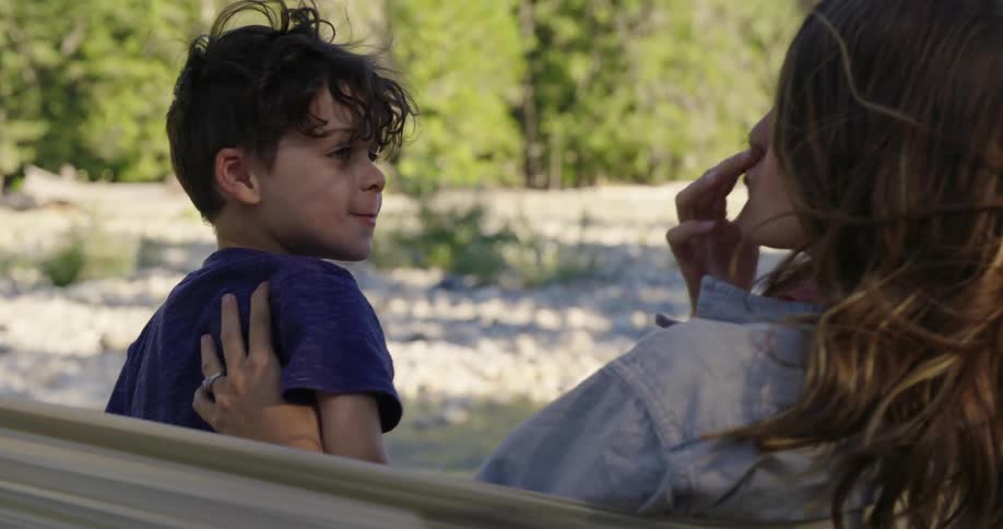Mother and son are outdoors together in spring