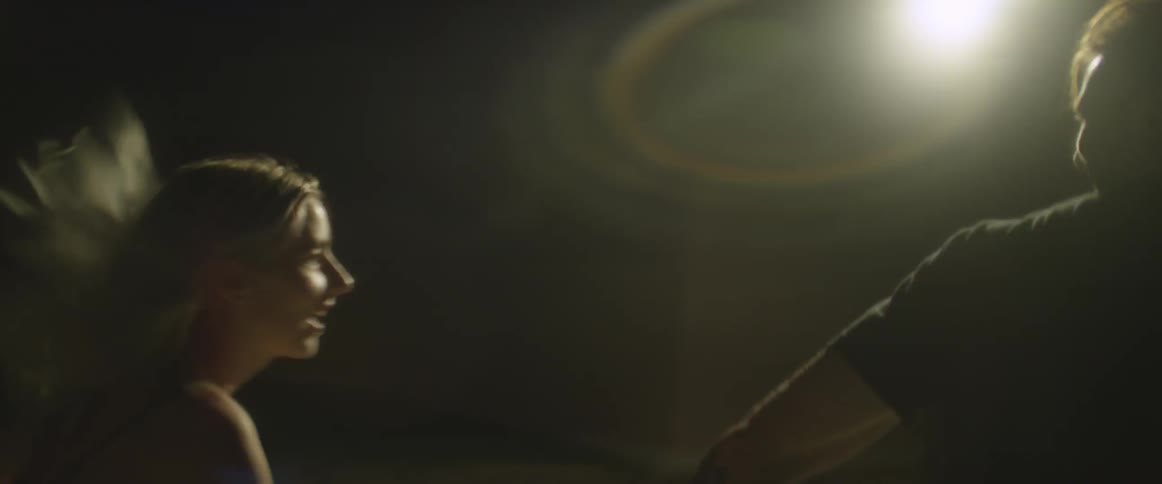 Couple running while holding hands in the dark