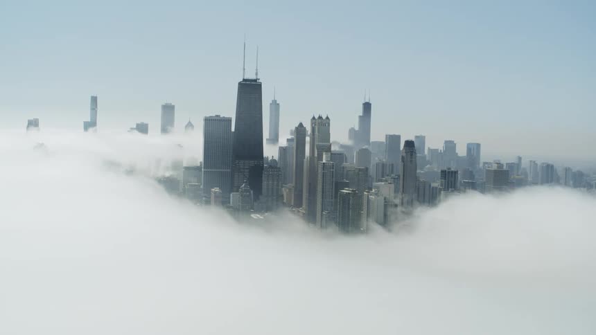 Chicago skyscrapers with heavy mist covering parts of it