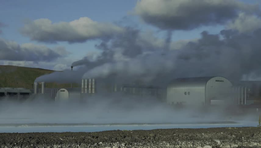 A view of smoke coming off a factory