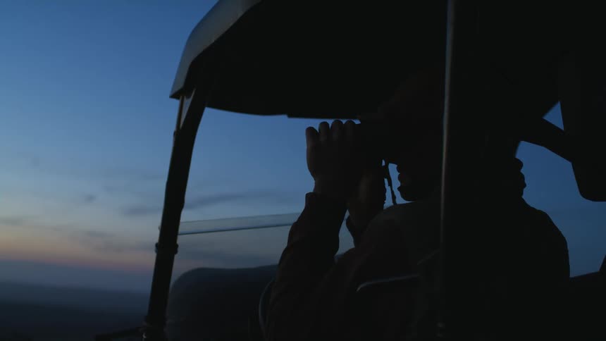 A person looking through binoculars