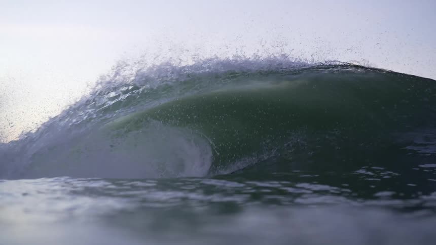 Waves in the ocean are moving fast at dusk