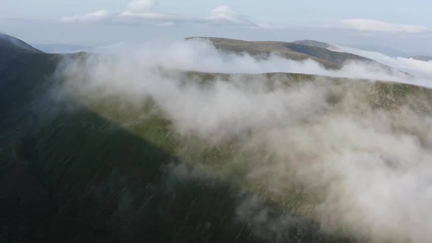 Clouds and fogs is covering the landscape at midday
