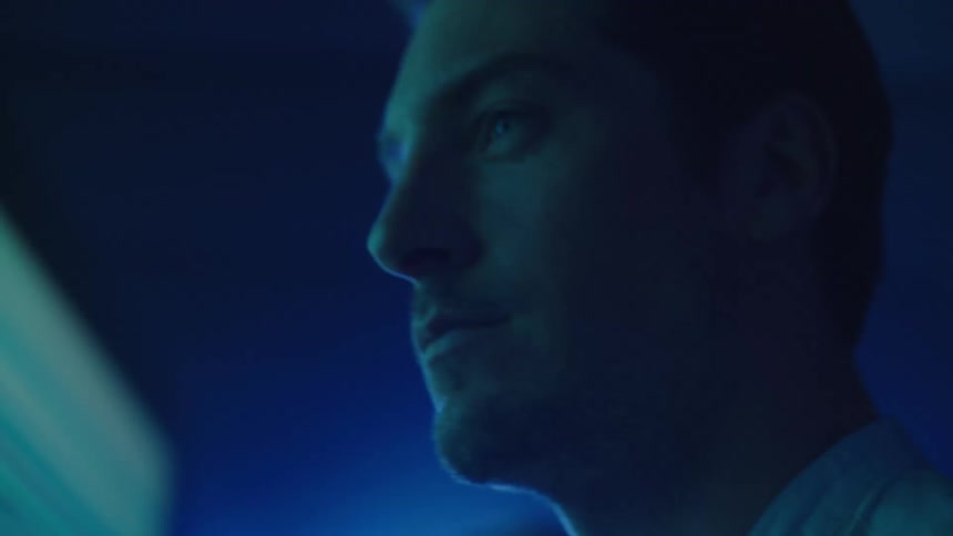 A man staring at a screen