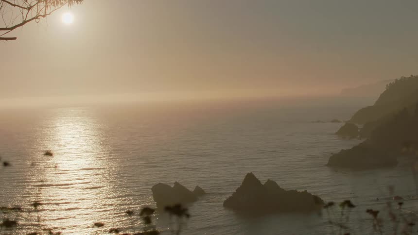 Sunlight shines down on gentle waves in the ocean