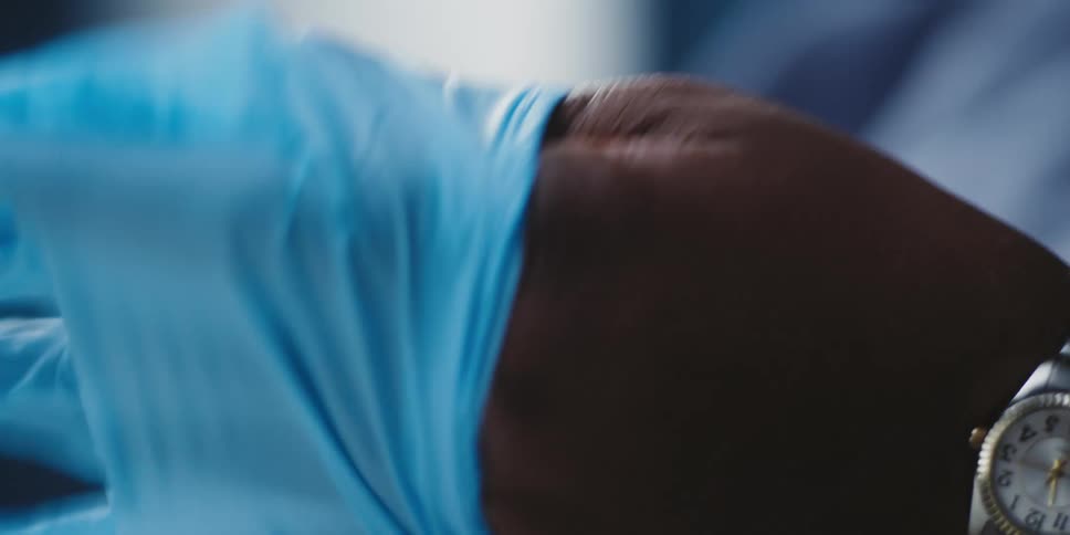 A person putting rubber gloves on their hands
