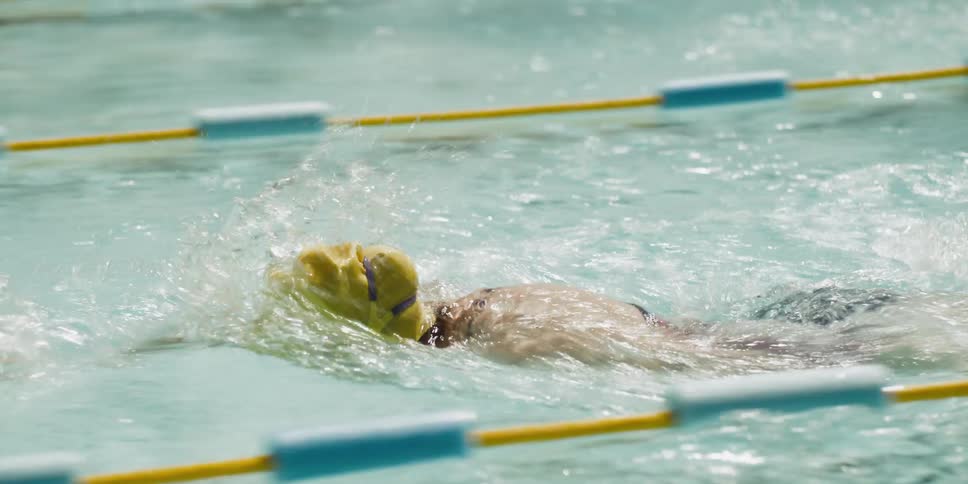People competing in a swim race