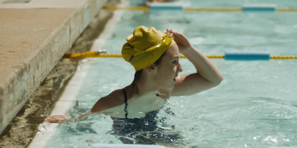 A simmer stops to raise her goggles