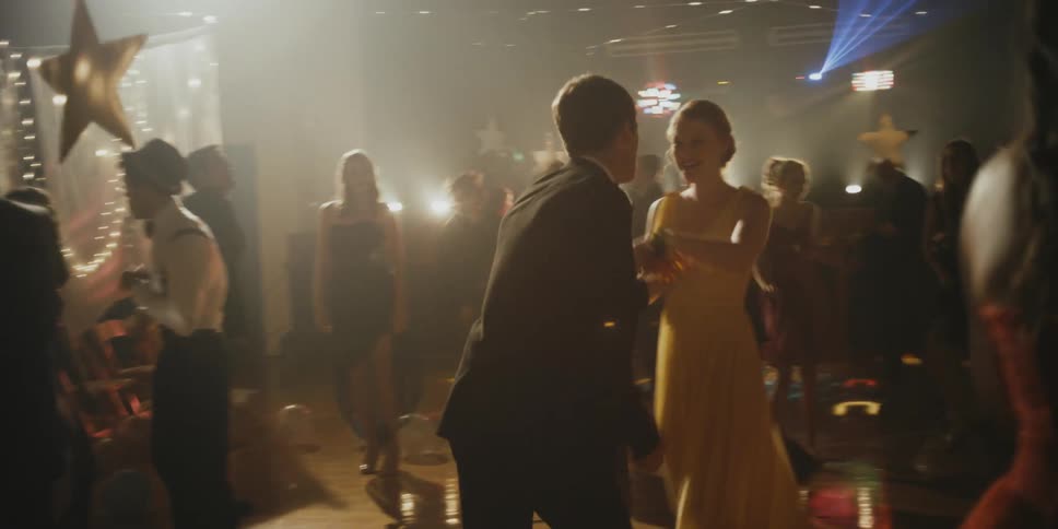 A dance has many teenagers dancing together